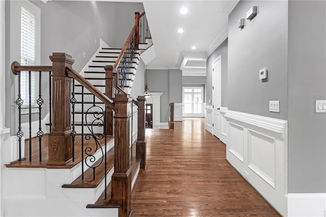 interior space featuring hardwood / wood-style flooring and ornamental molding