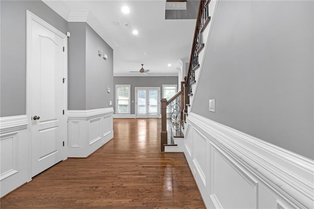 hall featuring dark wood-type flooring and ornamental molding