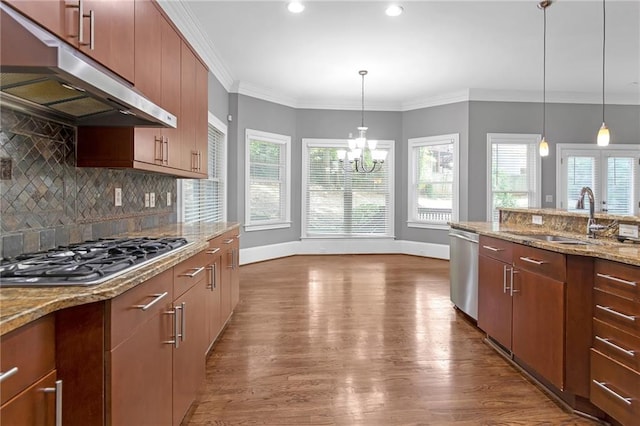 kitchen featuring hardwood / wood-style floors, plenty of natural light, and stainless steel appliances