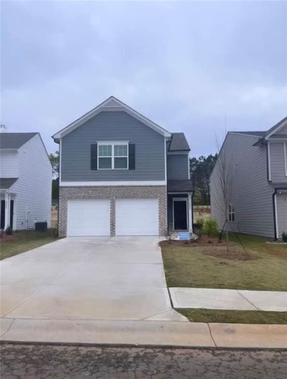 view of front facade featuring central AC, a front yard, and a garage