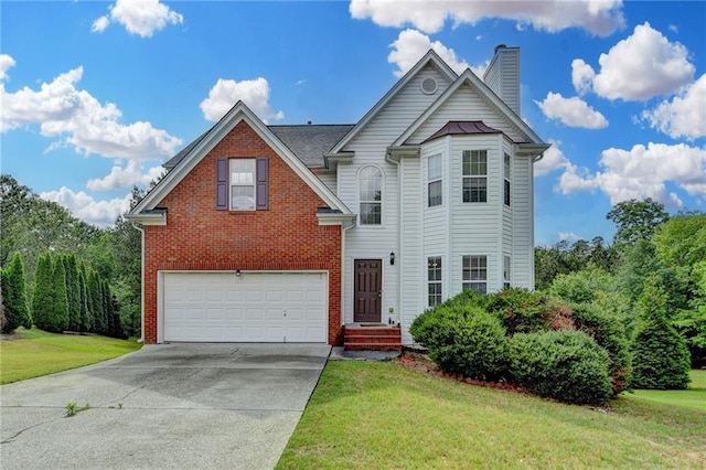 view of front facade featuring a garage, brick siding, driveway, and a front yard