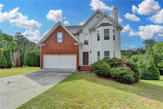 view of front of house featuring brick siding, an attached garage, concrete driveway, and a front yard