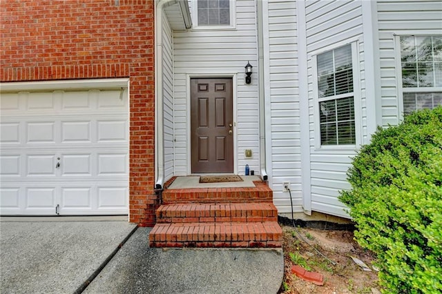 doorway to property with brick siding