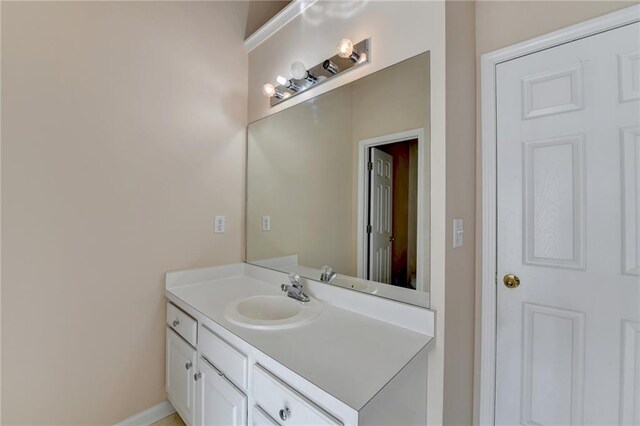 bathroom featuring vanity and baseboards