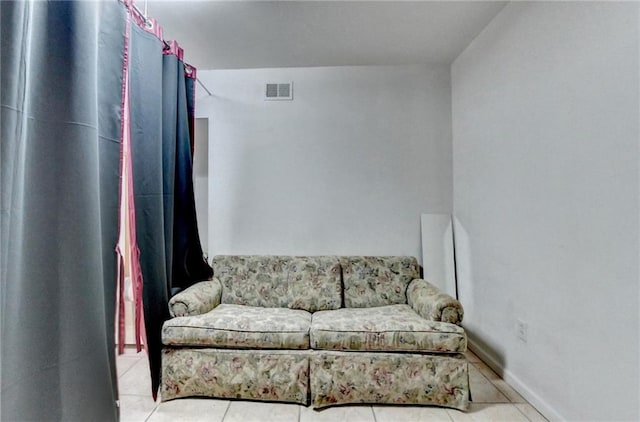 tiled living room with baseboards