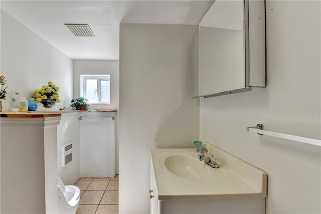 bathroom with tile patterned floors and vanity