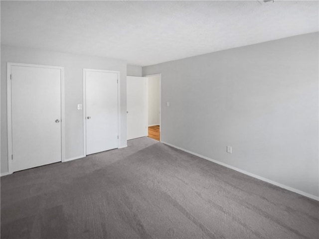 unfurnished bedroom featuring carpet