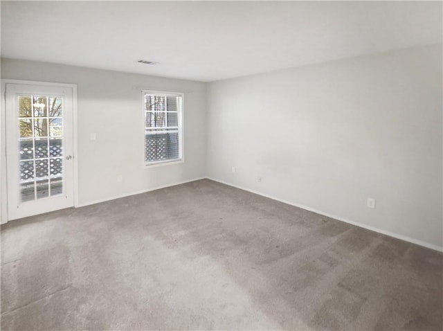 empty room with carpet flooring