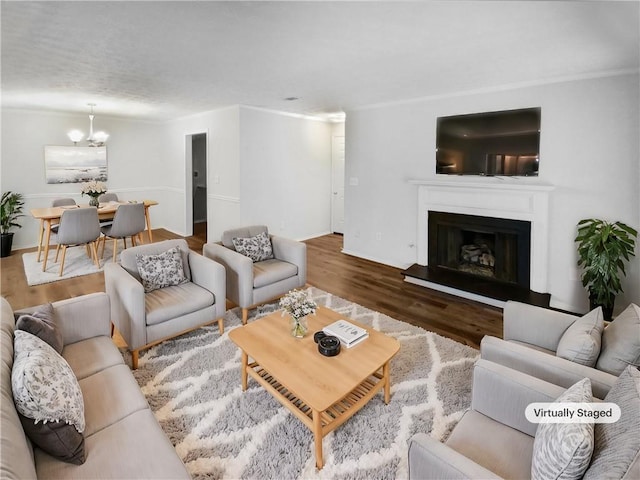 living room featuring hardwood / wood-style floors and a chandelier