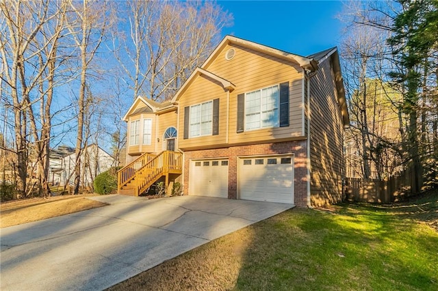 view of front of house with a garage and a front lawn