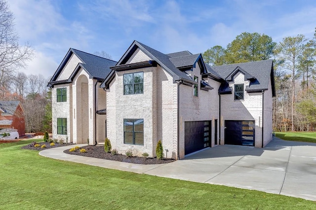 view of property exterior with a lawn, driveway, a garage, brick siding, and roof with shingles
