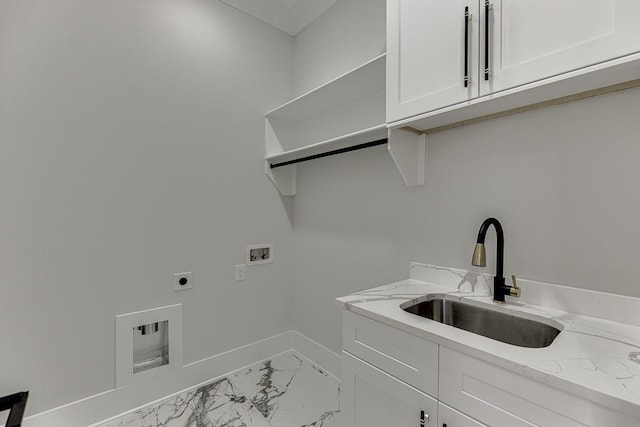 laundry room with marble finish floor, a sink, hookup for a washing machine, electric dryer hookup, and cabinet space