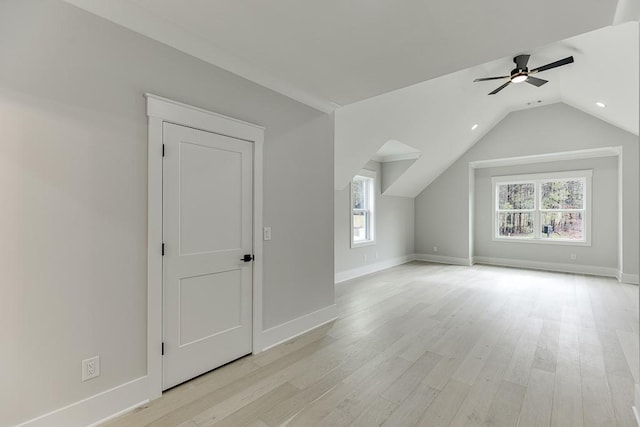 bonus room with light wood-type flooring, baseboards, and ceiling fan