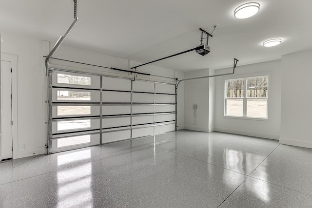 garage featuring baseboards and a garage door opener