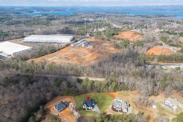 birds eye view of property with a forest view
