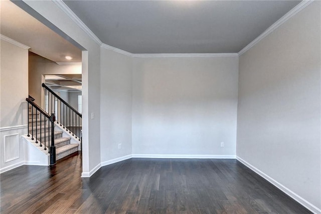 spare room with dark hardwood / wood-style flooring and crown molding