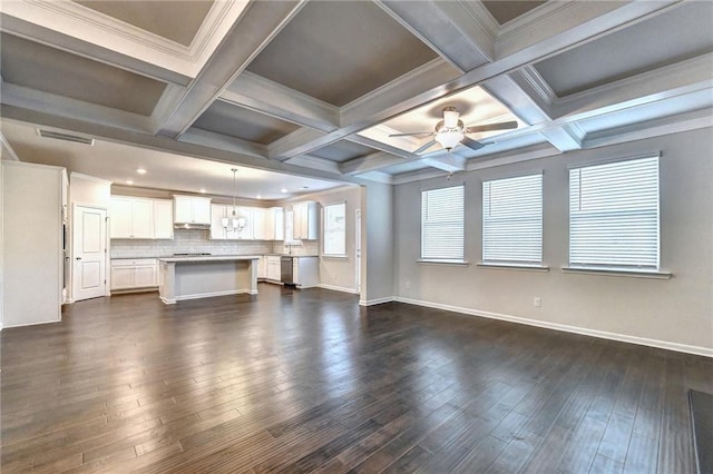 unfurnished living room with beamed ceiling, ornamental molding, ceiling fan, and coffered ceiling