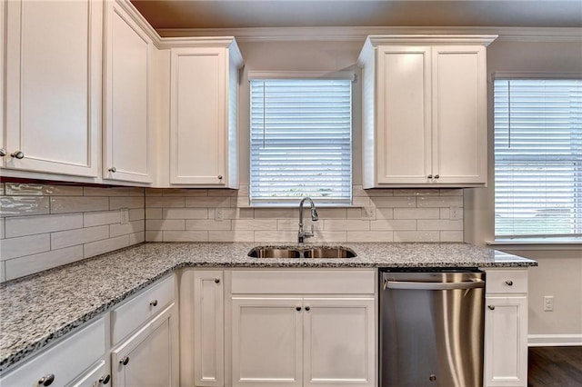 kitchen with white cabinets, dishwasher, light stone countertops, and sink