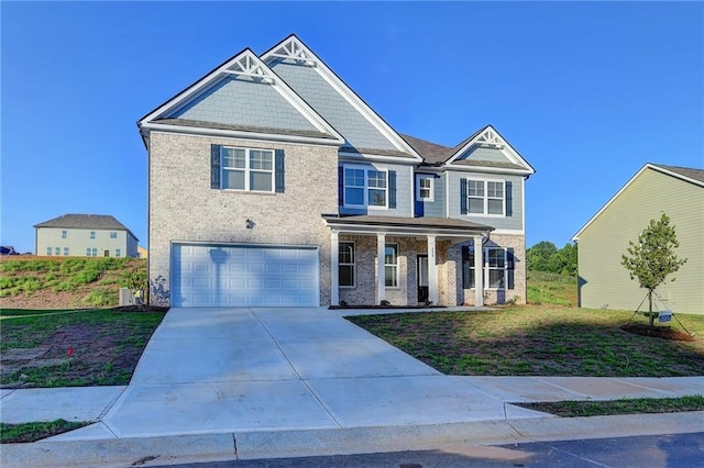 craftsman inspired home featuring a porch and a garage