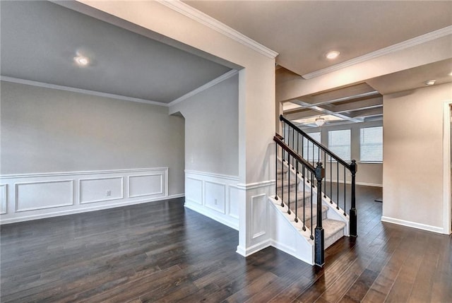 staircase with wood-type flooring, crown molding, and coffered ceiling