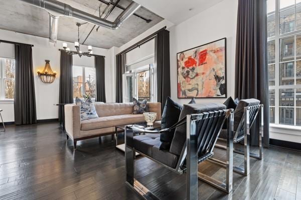 interior space featuring a notable chandelier and dark wood finished floors