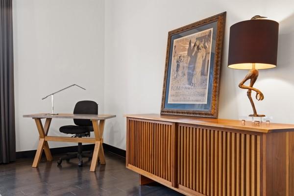 office area with baseboards and wood finished floors