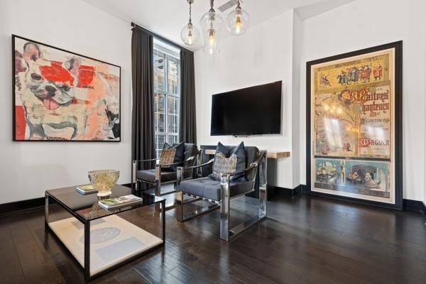 sitting room featuring hardwood / wood-style floors and baseboards