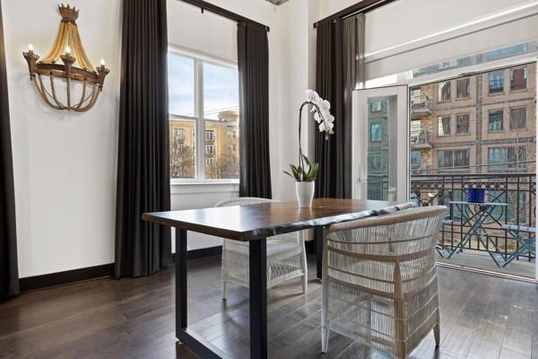 dining area with baseboards and wood finished floors