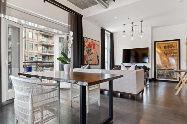 dining space featuring dark wood-style floors and a healthy amount of sunlight
