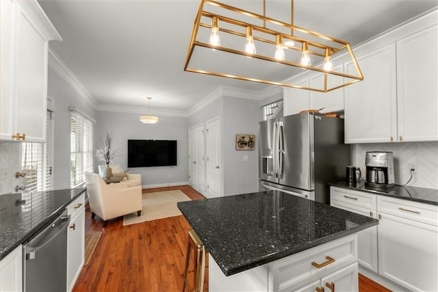 1560 Gilstrap Ln NW, Atlanta, GA 30318 - kitchen with appliances with stainless steel finishes, open floor plan, crown molding, and white cabinetry