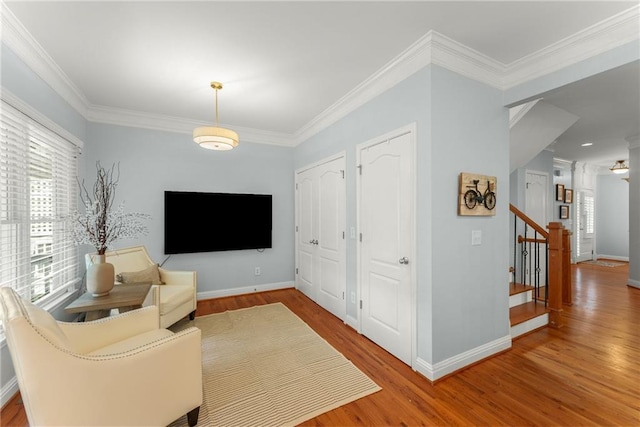 1560 Gilstrap Ln NW, Atlanta, GA 30318 - living area with wood finished floors, ornamental molding, and stairway