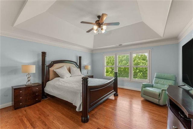 1560 Gilstrap Ln NW, Atlanta, GA 30318 - bedroom with a raised ceiling, wood finished floors, ceiling fan, and ornamental molding