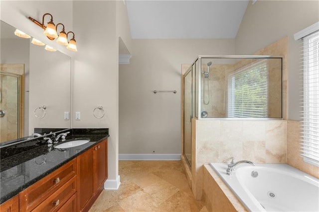 1560 Gilstrap Ln NW, Atlanta, GA 30318 - bathroom featuring vanity, a stall shower, a tub with jets, plenty of natural light, and lofted ceiling