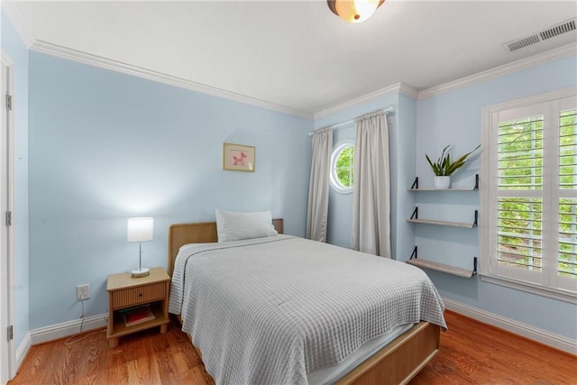 1560 Gilstrap Ln NW, Atlanta, GA 30318 - bedroom with wood finished floors and ornamental molding