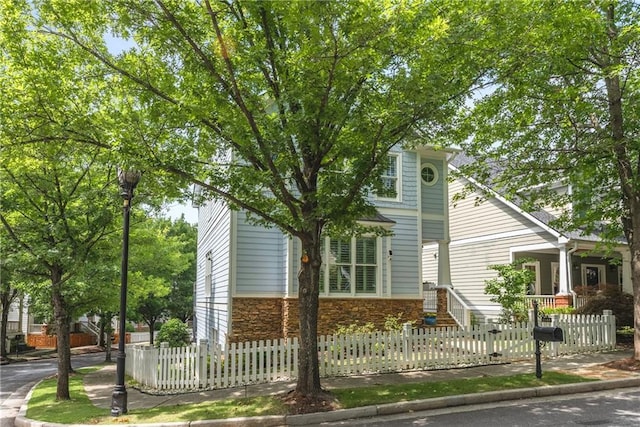 1560 Gilstrap Ln NW, Atlanta, GA 30318 - view of front of property with stone siding and a fenced front yard