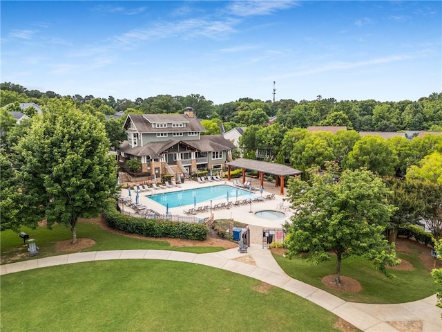 1560 Gilstrap Ln NW, Atlanta, GA 30318 - community pool with a hot tub, view of scattered trees, and a patio