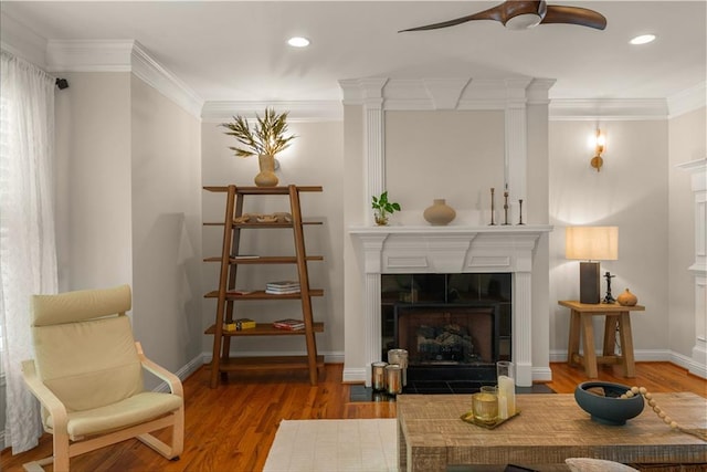 1560 Gilstrap Ln NW, Atlanta, GA 30318 - living area with ceiling fan, ornamental molding, wood finished floors, a fireplace, and recessed lighting