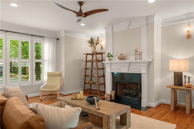 1560 Gilstrap Ln NW, Atlanta, GA 30318 - living area with crown molding, ceiling fan, wood finished floors, a tile fireplace, and recessed lighting