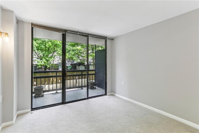 1130 Piedmont Ave NE Unit 410, Atlanta, GA 30309 - unfurnished room with carpet floors and baseboards