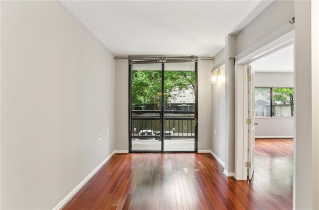 1130 Piedmont Ave NE Unit 410, Atlanta, GA 30309 - spare room with wood-type flooring and baseboards