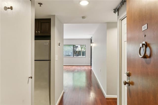 1130 Piedmont Ave NE Unit 410, Atlanta, GA 30309 - hallway with baseboards and dark wood-style flooring