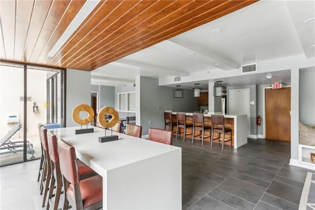 1130 Piedmont Ave NE Unit 410, Atlanta, GA 30309 - dining space with visible vents and wooden ceiling