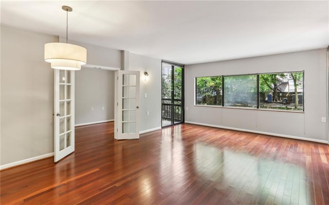 1130 Piedmont Ave NE Unit 410, Atlanta, GA 30309 - spare room with french doors, a healthy amount of sunlight, and wood finished floors