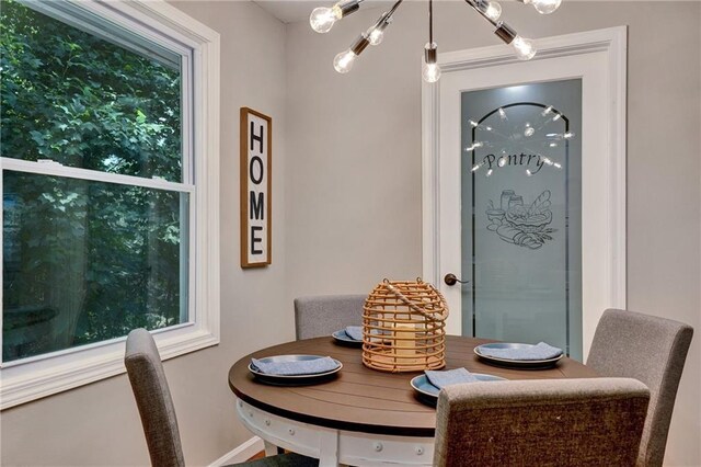 dining space with a notable chandelier