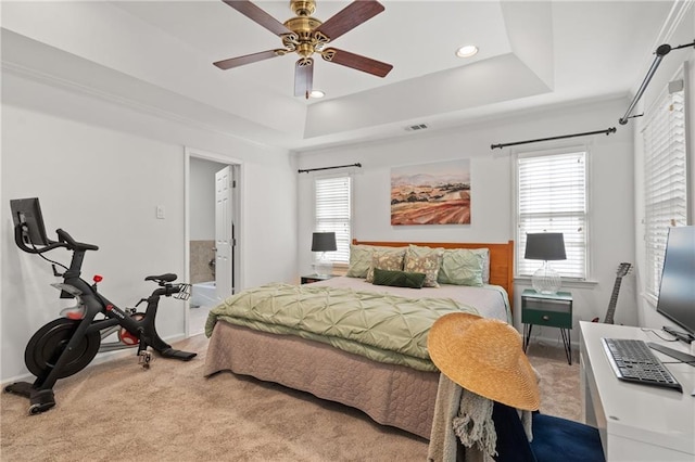 carpeted bedroom featuring recessed lighting, a raised ceiling, visible vents, and ceiling fan