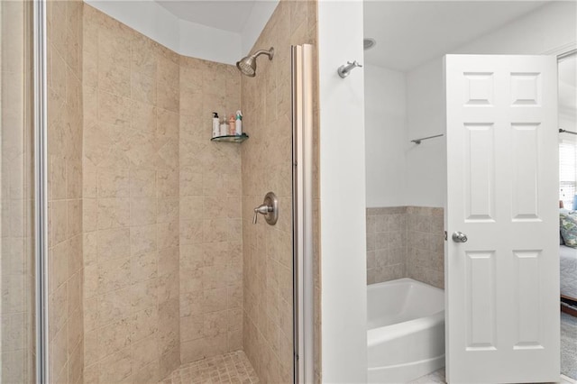 ensuite bathroom with a bath, a stall shower, and connected bathroom