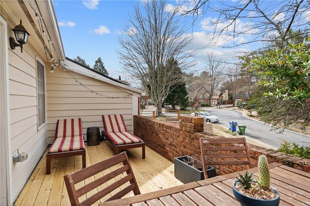 wooden terrace with a residential view