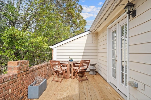 deck featuring outdoor dining area