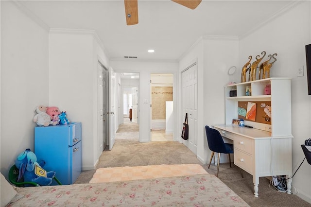 office area featuring visible vents, ornamental molding, baseboards, and light colored carpet