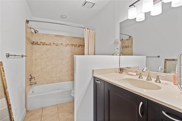 full bath featuring tile patterned flooring, toilet, visible vents, vanity, and shower / bath combo with shower curtain